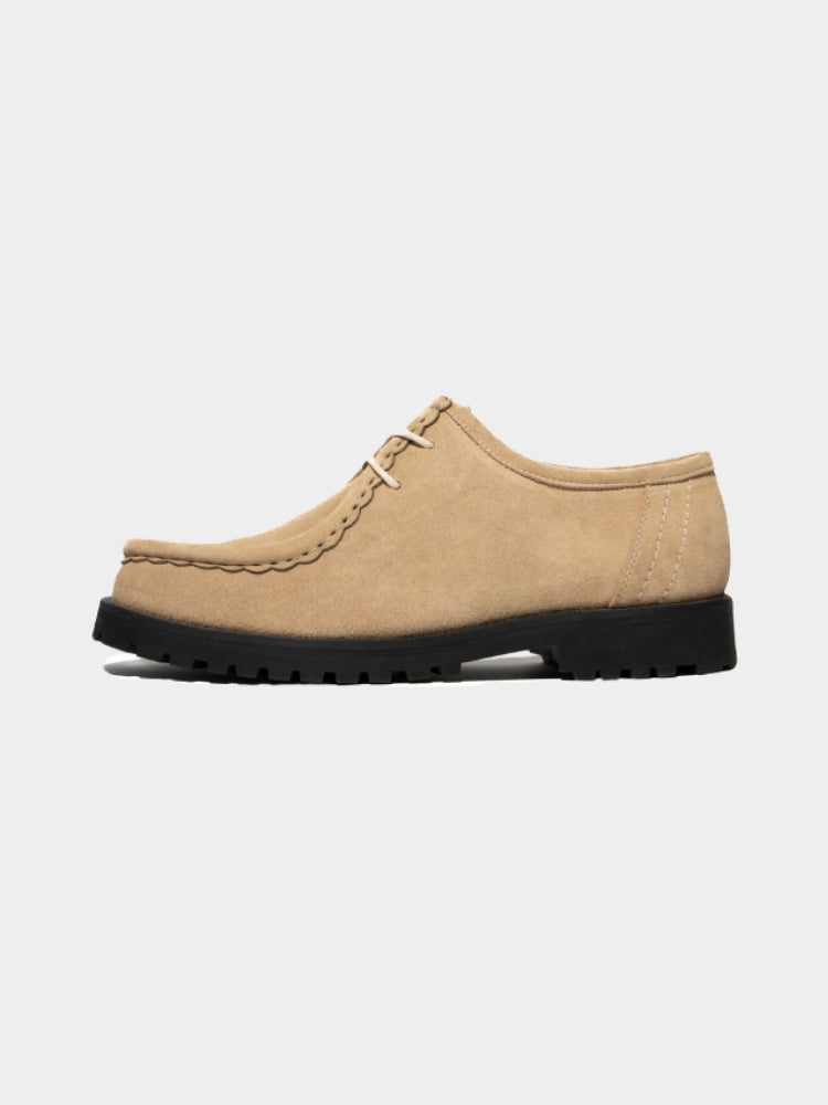 Beige Mercer Society Lug Moc Derby shoes with rounded toes and leather uppers, displayed on a plain background.