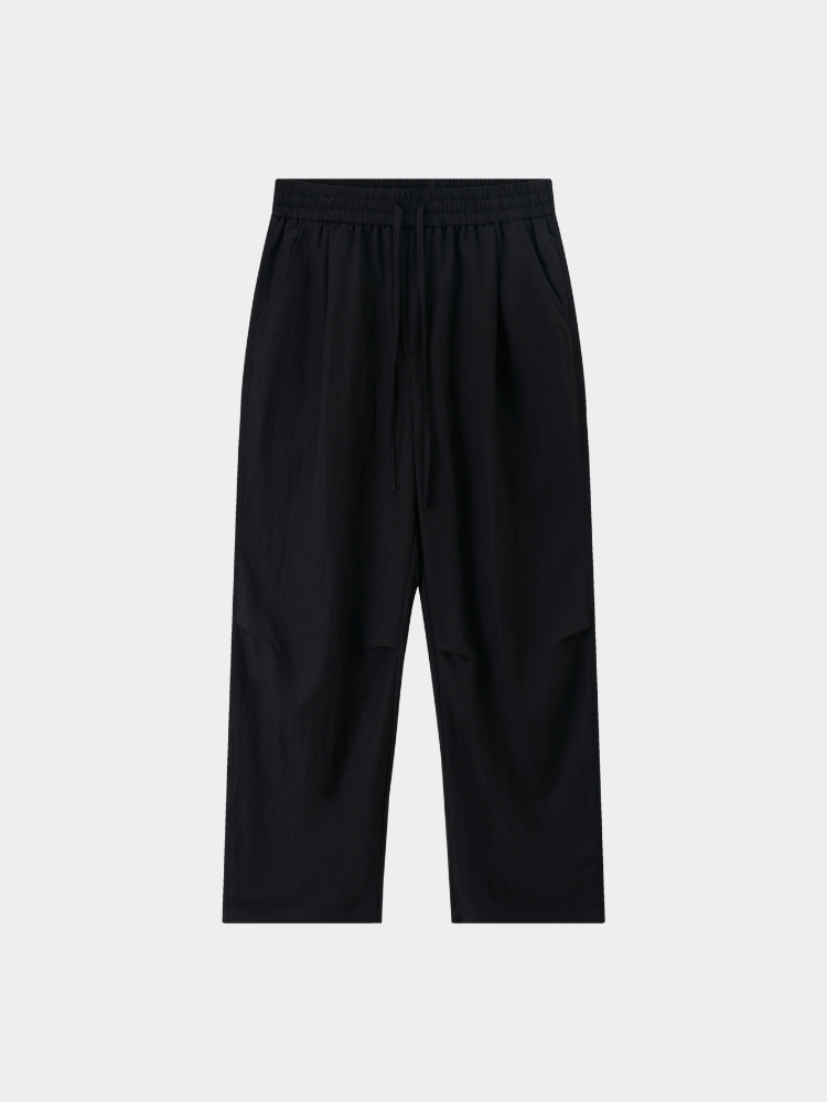 Black Mercer Society Drift Trousers with a tailored fit and sleek design, displayed on a neutral background.