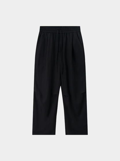 Black Mercer Society Drift Trousers with a tailored fit and sleek design, displayed on a neutral background.