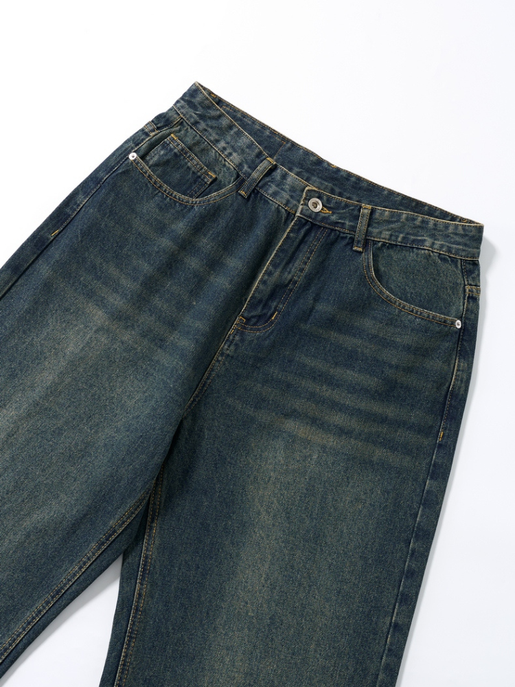 Mercer Society Fathom Jeans in dark wash denim, shown on a model with a relaxed fit and classic five-pocket design.
