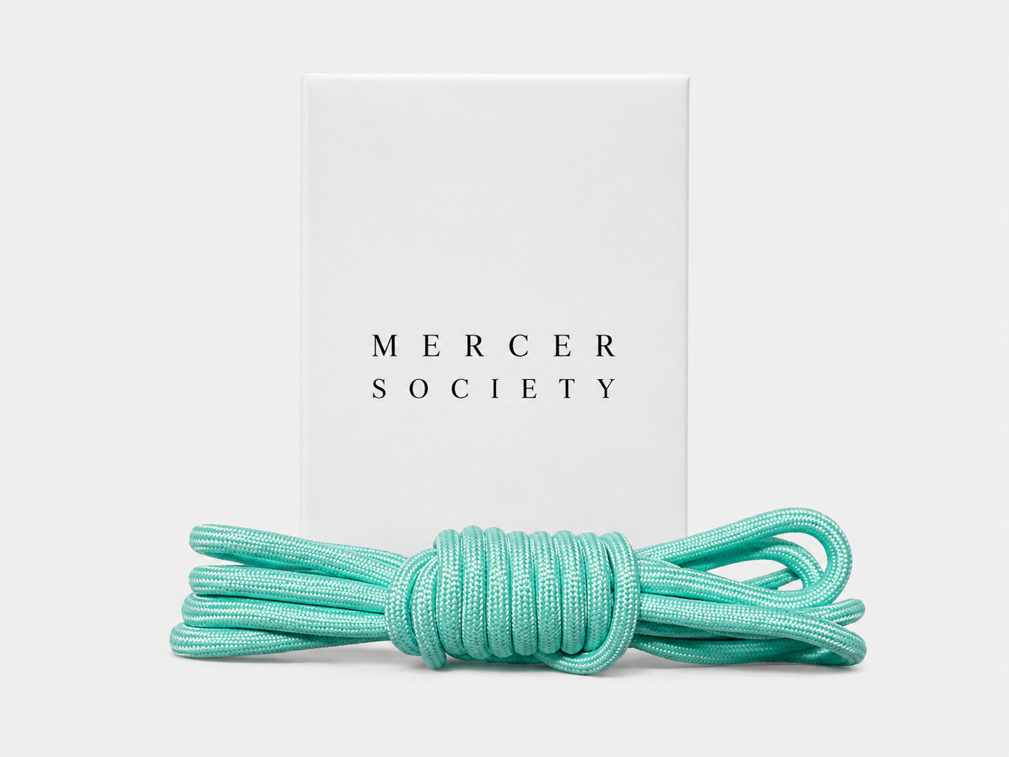 Turquoise Mercer Society laces with eyelet holes, suitable for sports shoes or sneakers, displayed on a plain background.